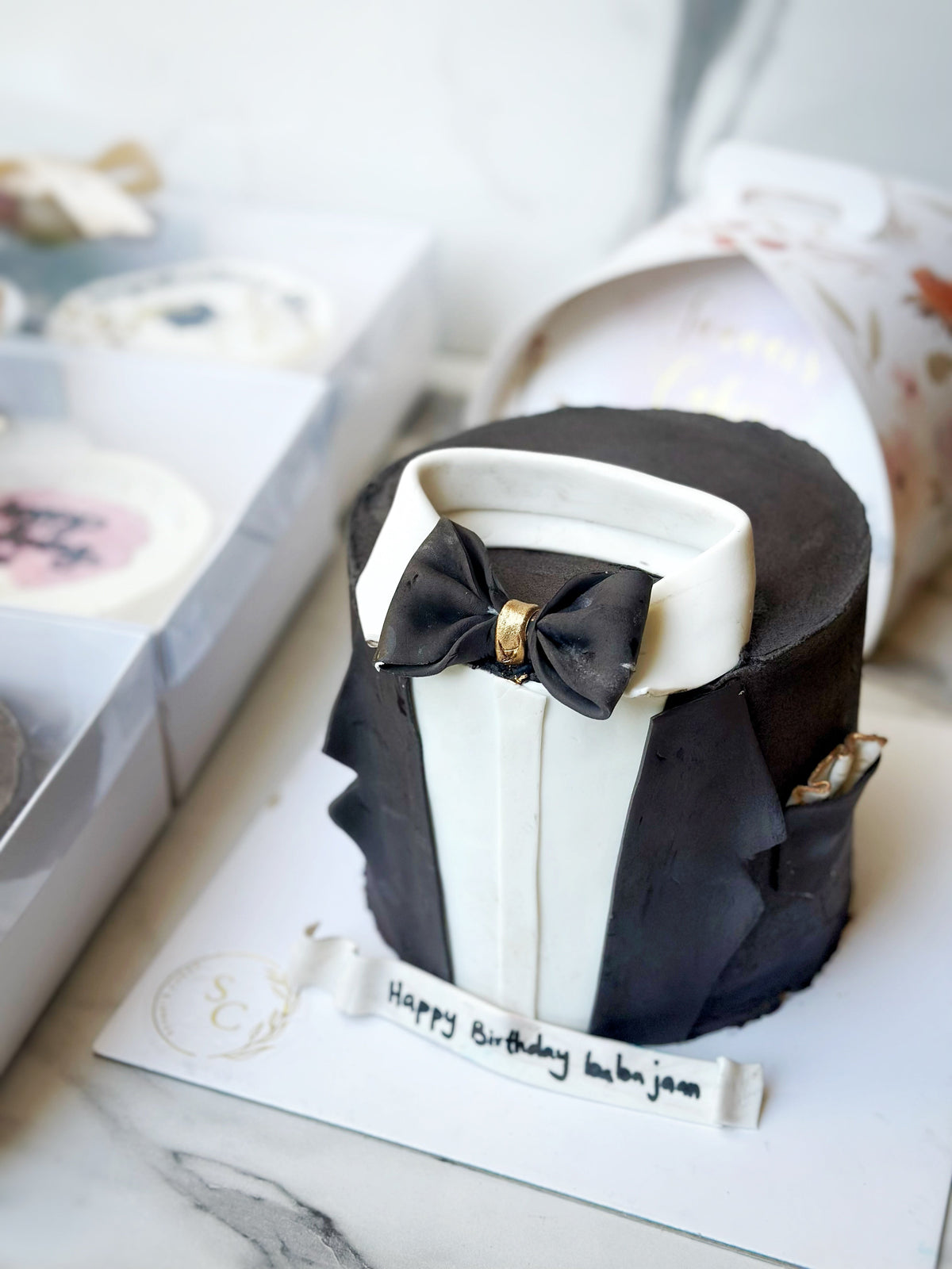 elegance in black cake from Saaaaiscakes Karachi